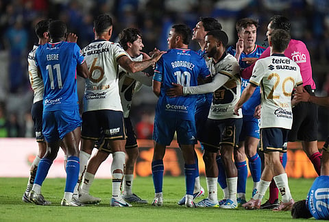 Players of Pumas and Cruz Azul argue during the Mexican soccer league first leg final match in Mexico City.