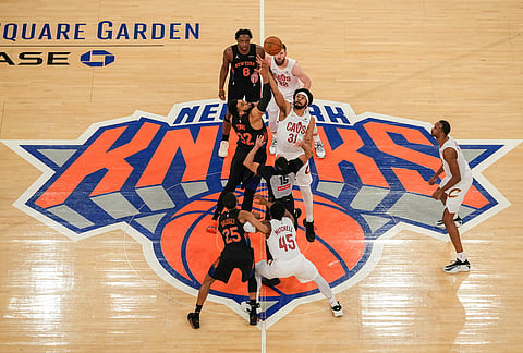 New York Knicks center Karl-Anthony Towns (32) fights for control of the ball with Cleveland Cavaliers center Jarrett Allen (31) during the first half of Game 2 in the Eastern Conference finals NBA basketball playoffs series, in New York. 