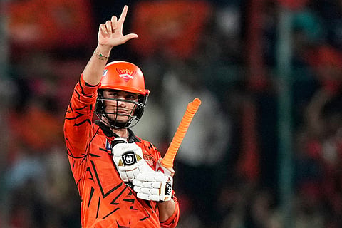 Sunrisers Hyderabad's Abhishek Sharma celebrates his fifty runs during the Indian Premier League cricket match between Sunrisers Hyderabad and Royal Challengers Bengaluru in Hyderabad, India.
