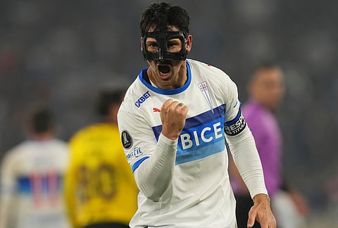 Fernando Zampedri of Chile's Universidad Catolica celebrates scoring his side's opening goal against Ecuador's Barcelona during a Copa Libertadores Group D soccer match in Santiago, Chile.