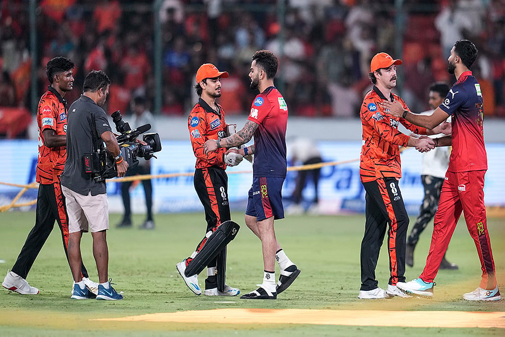 | Photo: PTI/Salman Ali : Royal Challengers Bengaluru's Virat Kohli greets Sunrisers Hyderabad's Ishan Kishan while Sunrisers Hyderabad's Travis Head interacts with Royal Challengers Bengaluru's Devdutt Padikkal, right, after SRH's win in the Indian Premier League (IPL) 2026 T20 cricket match between Sunrisers Hyderabad and Royal Challengers Bengaluru in Hyderabad, Telangana.