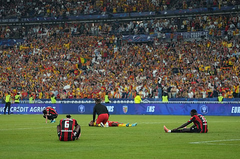 Nice players react after losing the French Cup soccer final between Nice and Lens in Saint-Denis, outside Paris.