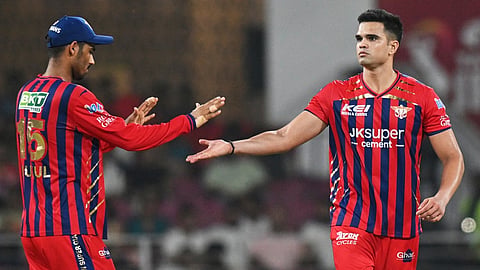 Arjun Tendulkar, right, celebrates the wicket of Prabhsimran Singh during the Indian Premier League match between Lucknow Super Giants and Punjab Kings in Lucknow.