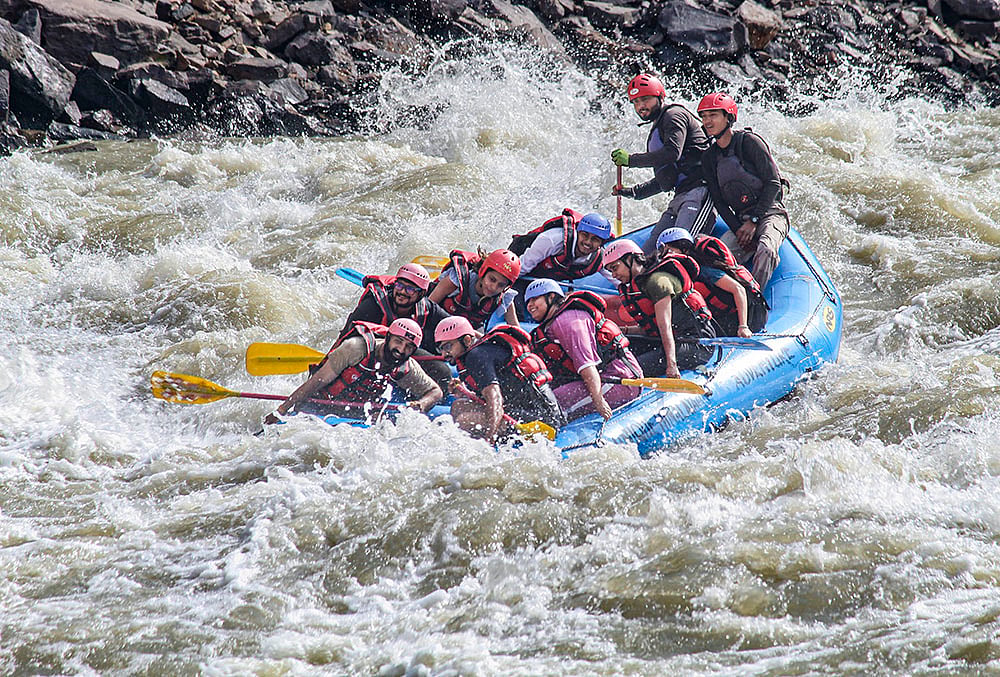 People take part in river rafting