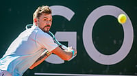 Martial Trezzini/Keystone via AP : Stan Wawrinka from Switzerland, returns a ball to Alex Michelsen from the U.S., during their round of 16 game at the ATP 250 Geneva Open tournament.