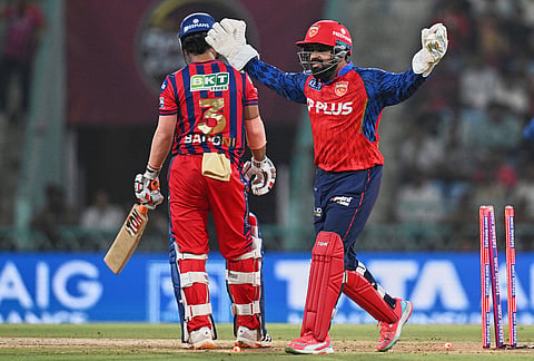 Punjab Kings' Prabhsimran Singh appeals successfully for the wicket of Lucknow Super Giants' Ayush Badoni, left, during the Indian Premier League cricket match between Lucknow Super Giants and Punjab Kings, in Lucknow.