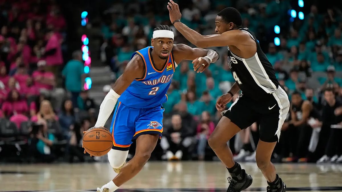 OKC's Shai Gilgeous-Alexander (left) in action against SA Spurs - AP
