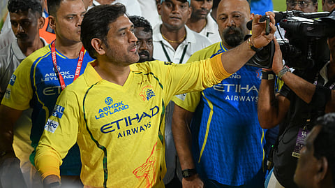 Chennai Super Kings’ Mahendra Singh Dhoni with teammates takes selfies with his fans after the Indian Premier League cricket match against Sunrisers Hyderabad in Chennai, India, Monday, May 18, 2026.