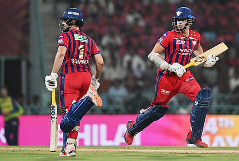 Lucknow Super Giants' Abdul Samad, left, and Arjun Tendulkar run between the wickets during the Indian Premier League cricket match between Lucknow Super Giants and Punjab Kings, in Lucknow.