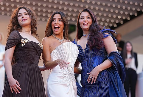 Ariana Greenblatt, from left, Eva Longoria, and Aishwarya Rai Bachchan pose for photographers upon arrival at the premiere of the film 'The Birthday Party' at the 79th international film festival, Cannes, southern France.