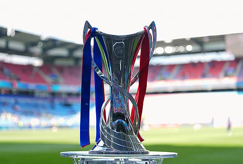 The tournament trophy is displayed on the pitch ahead of the Women's Champions League final soccer match between FC Barcelona and OL Lyonnes, in Oslo.