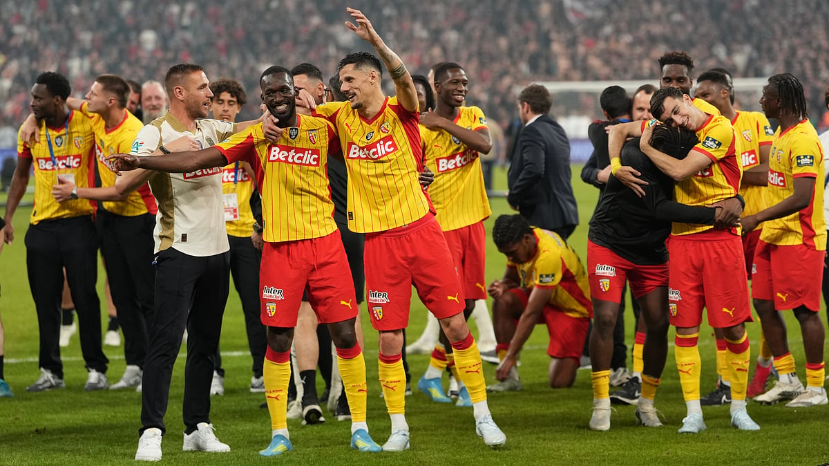 Lens players celebrate after winning the French Cup soccer final between Nice and Lens in Saint-Denis, outside Paris, Friday, May 22, 2026. - | Photo: AP/Thibault Camus