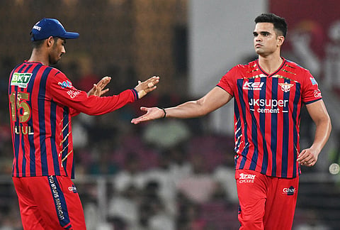 Lucknow Super Giants' Arjun Tendulkar, right, celebrates the wicket of Punjab Kings' Prabhsimran Singh during the Indian Premier League cricket match between Lucknow Super Giants and Punjab Kings, in Lucknow.