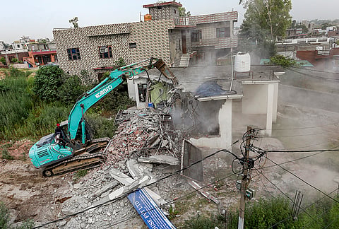 A joint anti-encroachment operation being conducted by District Administration and Jammu and Kashmir Police against properties linked to alleged drug smugglers, at Indra Nagar, in the outskirts of Jammu.