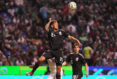 Mexico's Eduardo Águila jumps for the ball during an international friendly soccer match against Ghana in Puebla, Mexico.