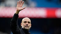 (AP Photo/Dave Thompson, File) : FILE - Manchester City's head coach Pep Guardiola greets fans at the end of the English Premier League soccer match between Manchester City and Brentford in Manchester, Saturday, May 9, 2026.