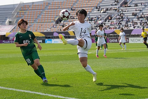 Naegohyang Women's FC's Choe Kum Ok, right, battles for the ball against Tokyo Verdy Beleza's Miyu Matsunaga during the AFC Women's Champions League soccer final match in Suwon, South Korea.
