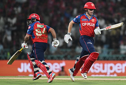 Punjab Kings' Prabhsimran Singh, left, and Cooper Connolly run between the wickets during the Indian Premier League cricket match between Lucknow Super Giants and Punjab Kings, in Lucknow.