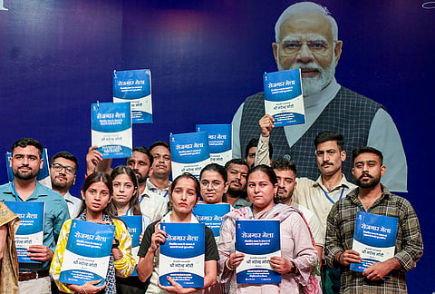 Candidates pose with their appointment letters during the 19th Rozgar Mela, in Jammu.