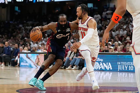 New York Knicks guard Jalen Brunson (11) defends against Cleveland Cavaliers guard James Harden (1) during the second half of Game 3 in the Eastern Conference finals NBA basketball playoffs series in Cleveland.