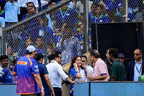 Mumbai Indians' owner and founder Nita Ambani interacts with presesnter Harsha Bhogle during an Indian Premier League (IPL) 2026 T20 cricket match between Mumbai Indians and Rajasthan Royals, in Mumbai, Maharashtra.