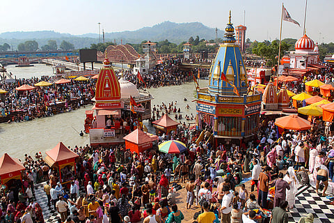 People gather to take a holy dip in the Ganga river at Har Ki Pauri ahead of the 'Ganga Dussehra' festival, in Haridwar, Uttarakhand.