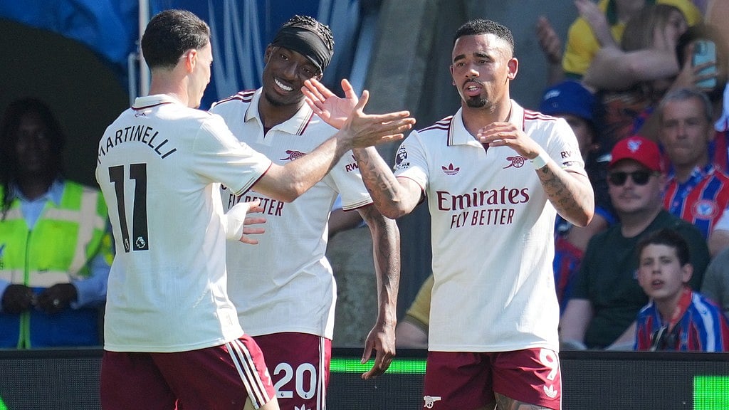 Gabriel Jesus, right, celebrates with Gabriel Martinelli, left, and Noni Madueke after scoring his side's opening goal during the English Premier League match between Crystal Palace and Arsenal in London. - Photo: AP/Kin Cheung