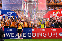 | Photo; Jordan Pettitt/PA via AP : Hull City players celebrate winning promotion to the Premier League following the Championship play-off final between Hull City and Middlesbrough at Wembley Stadium, London.