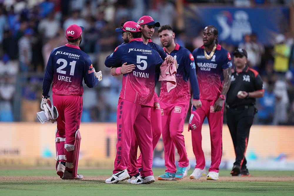Rajasthan Royals' captain Riyan Parag, second from left, and Nandre Burger celebrates after their win in the Indian Premier League cricket match against Mumbai Indians in Mumbai, India. - | Photo: AP/Ajit Solanki