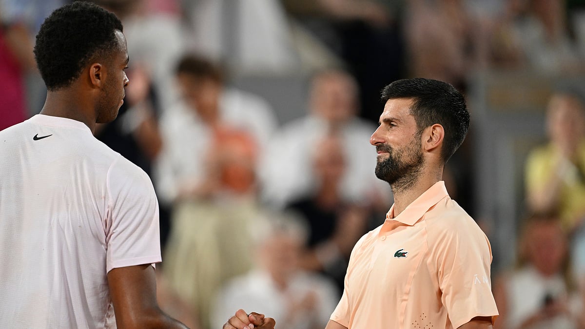Novak Djokovic of Serbia, right, and Giovanni Mpetshi Perricard shake hands after their first round men's singles tennis match of France at the French Open tennis tournament in Paris, Sunday, May 24, 2026 - (AP Photo/Emma Da Silva)