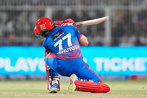 Delhi Capitals' Ashutosh Sharma ducks under a bounce ball during the Indian Premier League cricket match between Delhi Capitals and Kolkata Knight Riders, in Kolkata, India.