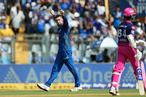Mumbai Indians' Will Jacks celebrates the wicket of Rajasthan Royals' Yashasvi Jaiswal, right, walks during the Indian Premier League cricket match between Mumbai Indians and Rajasthan Royals in Mumbai, India.