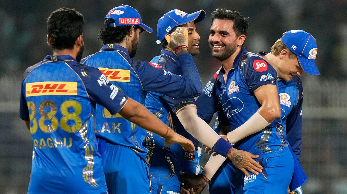 Mumbai Indians' Deepak Chahar, centre, celebrates with teammates the wicket of Kolkata Knight Riders' Finn Allen during the Indian Premier League cricket match between Kolkata Knight Riders and Mumbai Indian. - AP Photo