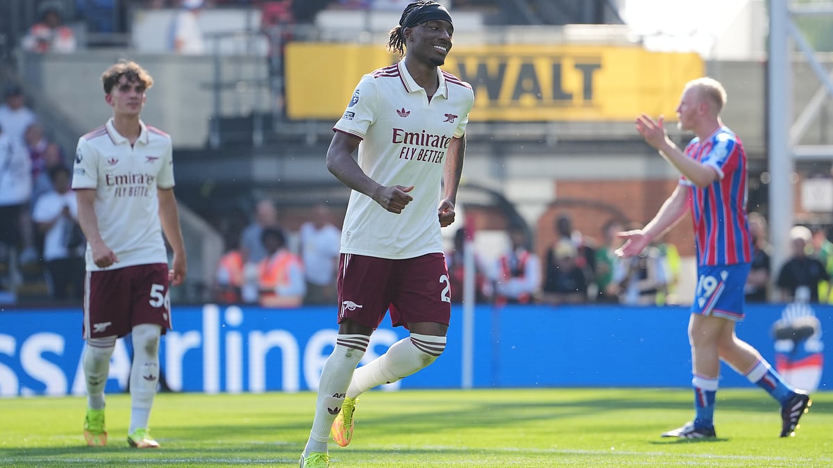 Arsenal's Noni Madueke celebrates after scoring his side's second goal during the English Premier League soccer match between Crystal Palace and Arsenal in London, England, Sunday, May 24, 2026 - (AP Photo/Kin Cheung)