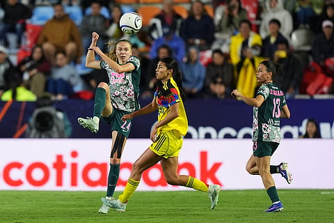 Esme Morgan of The United States' Washington Spirit, left, and Montserrat Saldívar of Mexico's America compete for the ball during the Women's CONCACAF Champions Cup final soccer match in Pachuca, Mexico.