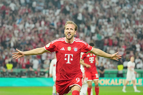 Bayern's Harry Kane celebrates after scoring during the German Cup final soccer match between VfB Stuttgart and Bayern Munich in Berlin, Germany, Saturday, May 23, 2026. ()