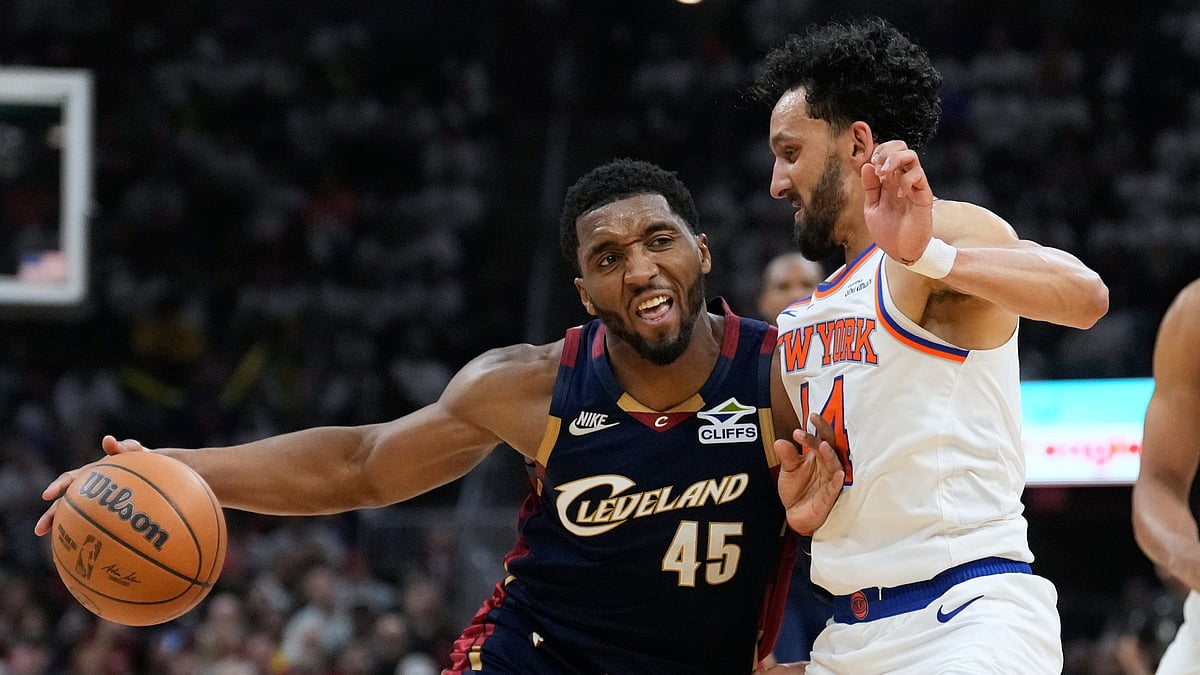 Cleveland Cavaliers guard Donovan Mitchell (45) controls the ball against New York Knicks guard Landry Shamet (44) during the second half of Game 3 in the Eastern Conference finals NBA basketball playoffs series in Cleveland. - AP/Sue Ogrocki