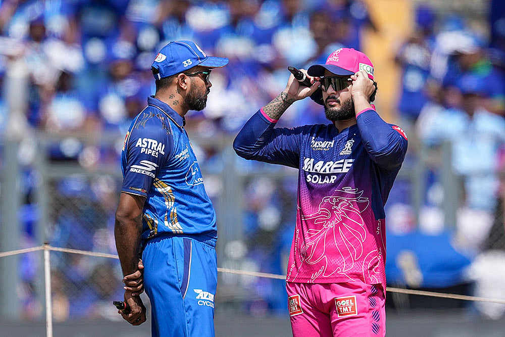 Mumbai Indians' captain Hardik Pandya, left, and Rajasthan Royals captain Riyan Parag during toss before an Indian Premier League (IPL) 2026 T20 cricket match between Mumbai Indians and Rajasthan Royals, in Mumbai, Maharashtra. - | Photo: PTI/Kunal Patil