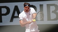 (AP Photo/Christophe Ena) : Alexander Zverev of Germany returns to Benjamin Bonzi of France during their first round men's singles tennis match at the French Open tennis tournament in Paris, Sunday, May 24, 2026.