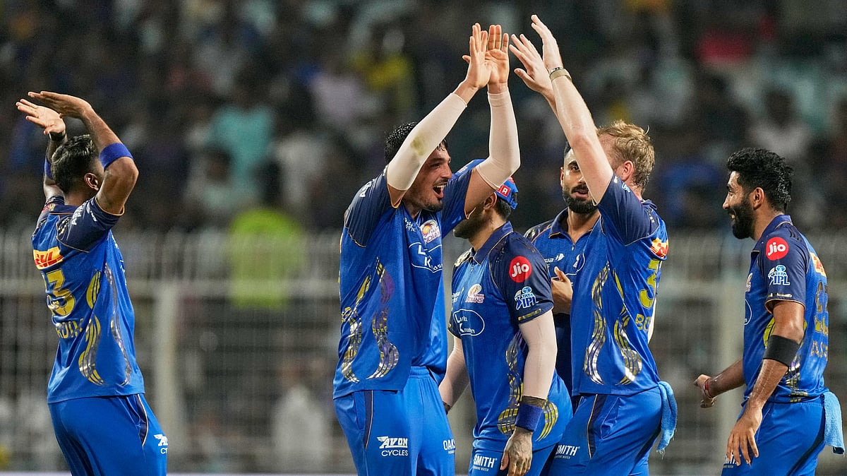 Mumbai Indians' Allah Gazanfar, centre, celebrates with teammates the wicket of Kolkata Knight Riders' Rovman Powell during the Indian Premier League cricket match between Kolkata Knight Riders and Mumbai Indians. - AP Photo