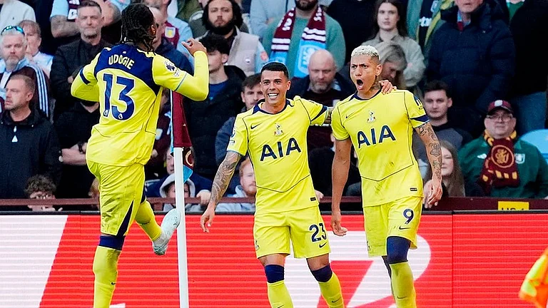 Tottenham's Richarlison, right, celebrates scoring their side's second goal during the English Premier League match between Aston Villa and Tottenham Hotspur in Birmingham, England. - | Photo: Nigel French/PA via AP