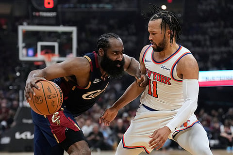 Cleveland Cavaliers guard James Harden (1) controls the ball against New York Knicks guard Jalen Brunson (11) during the second half of Game 3 in the Eastern Conference finals NBA basketball playoffs series in Cleveland.