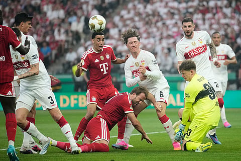 Bayern's Jamal Musiala, centre, Bayern's Harry Kane, bottom, challenge for the ball with Stuttgart's Angelo Stiller, centre right, during the DFB Pokal, German Cup final soccer match between VfB Stuttgart and Bayern Munich in Berlin, Germany.