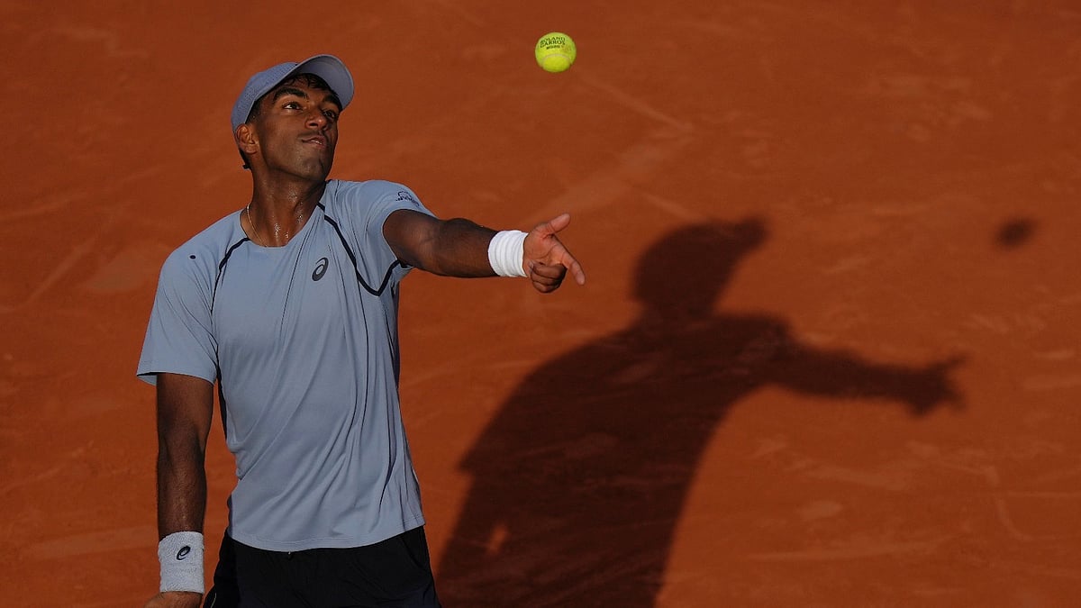 Nishesh Basavareddy of the U.S. serves to Taylor Fritz of the U.S. during their first round men's singles tennis match at the French Open tennis tournament in Paris, Sunday, May 24, 2026. - (AP Photo/Aurelien Morissard)