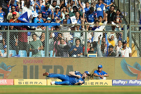 Mumbai Indians' Corbin Bosch takes the catch to dismiss Rajasthan Royals' Donovan Ferreira during the Indian Premier League cricket match between Mumbai Indians and Rajasthan Royals in Mumbai, India.