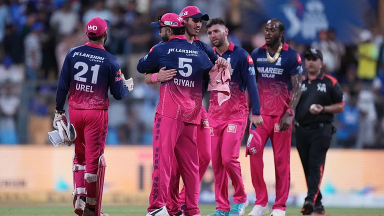 Rajasthan Royals' captain Riyan Parag, second from left, and Nandre Burger celebrates after their win in the Indian Premier League cricket match against Mumbai Indians in Mumbai, India, Sunday, May 24, 2026. - AP Photo/Ajit Solanki
