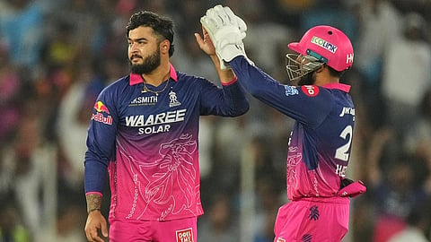 Rajasthan Royals' captain Riyan Parag, left, and Dhruv Jurel celebrates the wicket of Gujarat Titans' Kumar Kushagra during the Indian Premier League cricket match between Gujarat Titans and Rajasthan Royals in Ahmedabad.