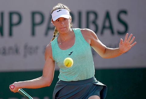 Solana Sierra of Argentina returns to Emma Raducanu of Britain during their first round women's singles tennis match against Solana Sierra of Argentina at the French Open tennis tournament in Paris.