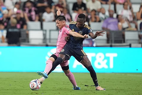 Inter Miami midfielder David Ayala, left, battles with Philadelphia Union defender Philippe Ndinga Ossibadjouo (20) during the second half of an MLS soccer match in Miami.