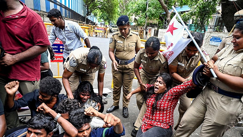 Police detain the Students' Federation of India (SFI) members as they take out a protest rally against the National Testing Agency (NTA) over the alleged paper leak concerns following the cancellation of the NEET-UG 2026 examination, in Chennai. - | Photo: PTI